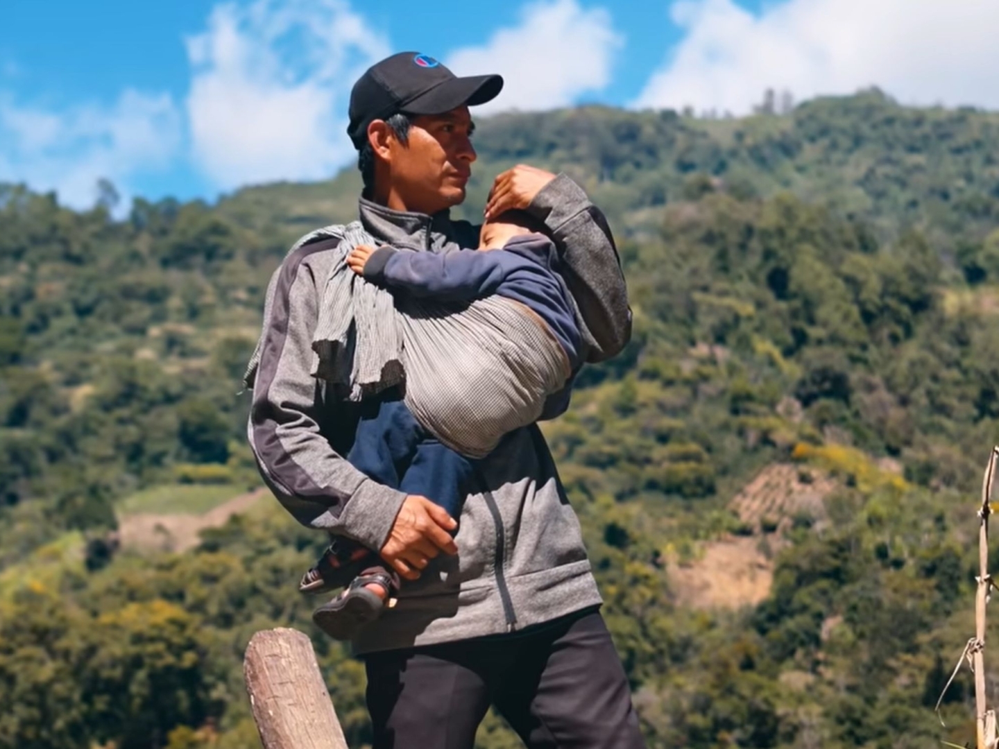 A father holds his child.