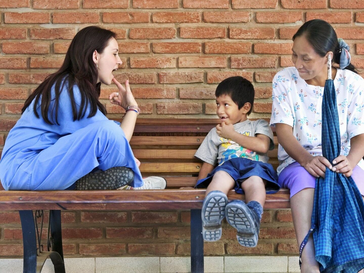 Operation Smile speech therapist Milena Cleves works with a patient.