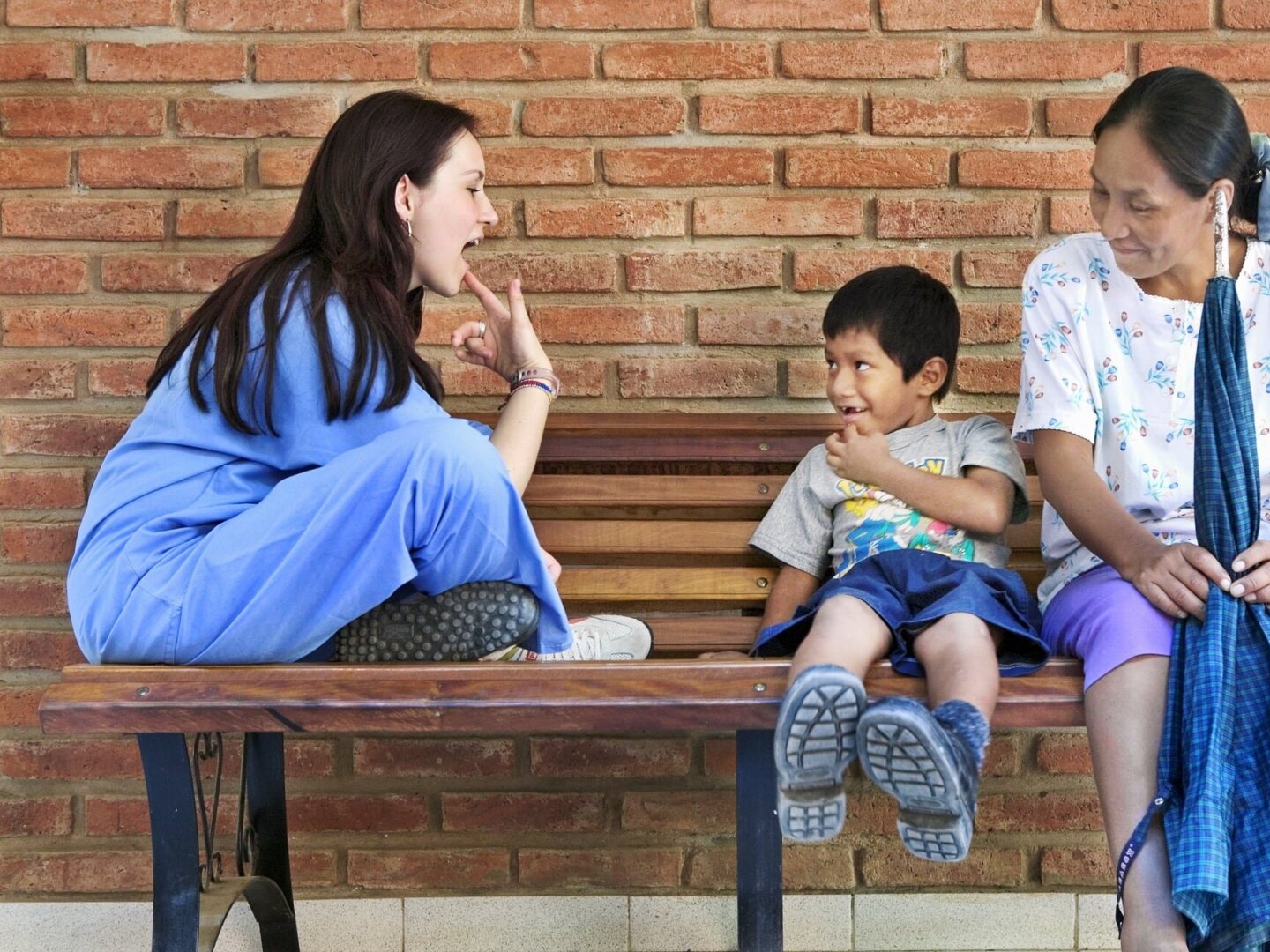 Operation Smile speech therapist Milena Cleves works with a patient.