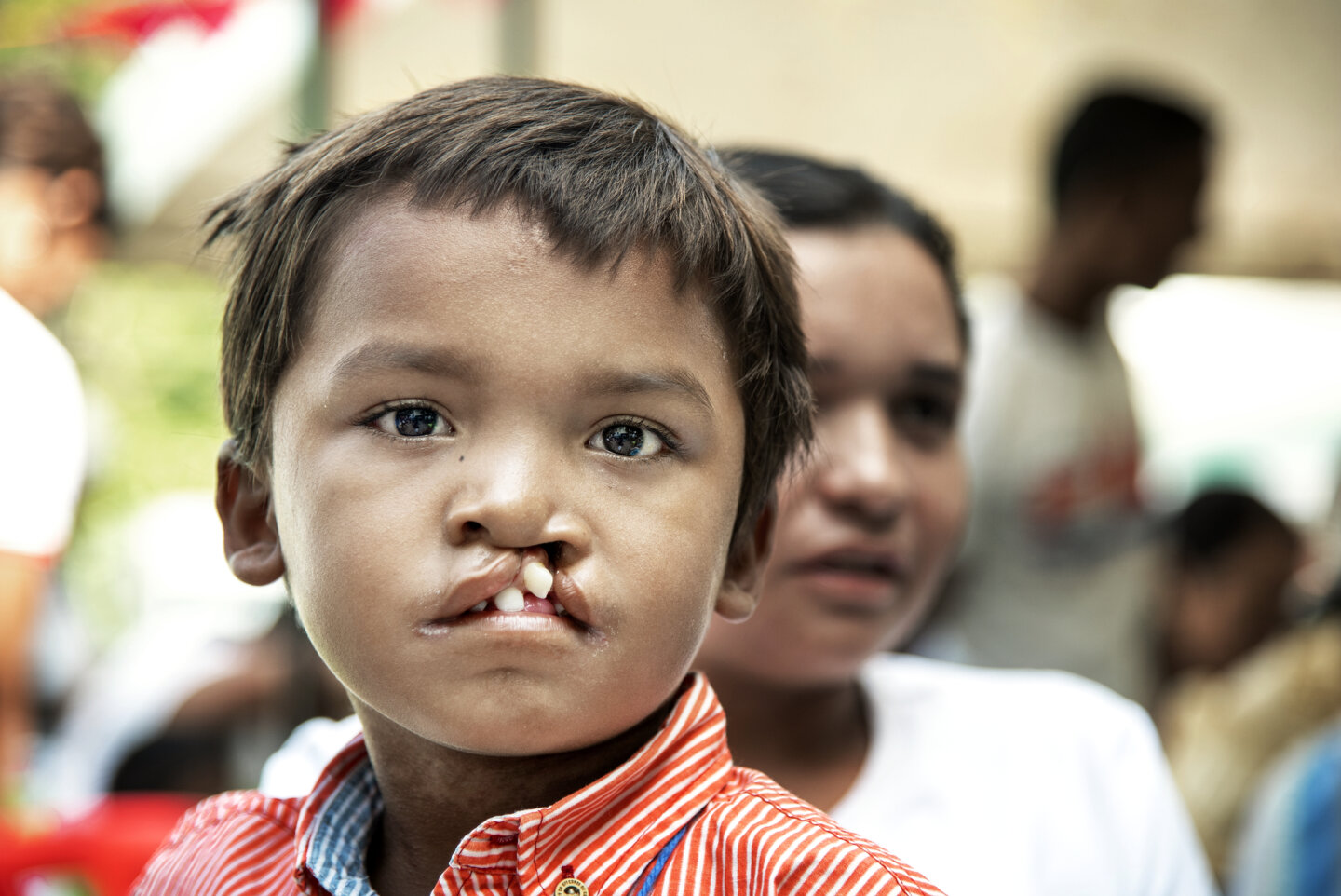 Pedro and Marbelis await Pedro's comprehensive health evaluation during the August 2019 Operation Smile Colombia surgical program to Riohacha, Colombia.