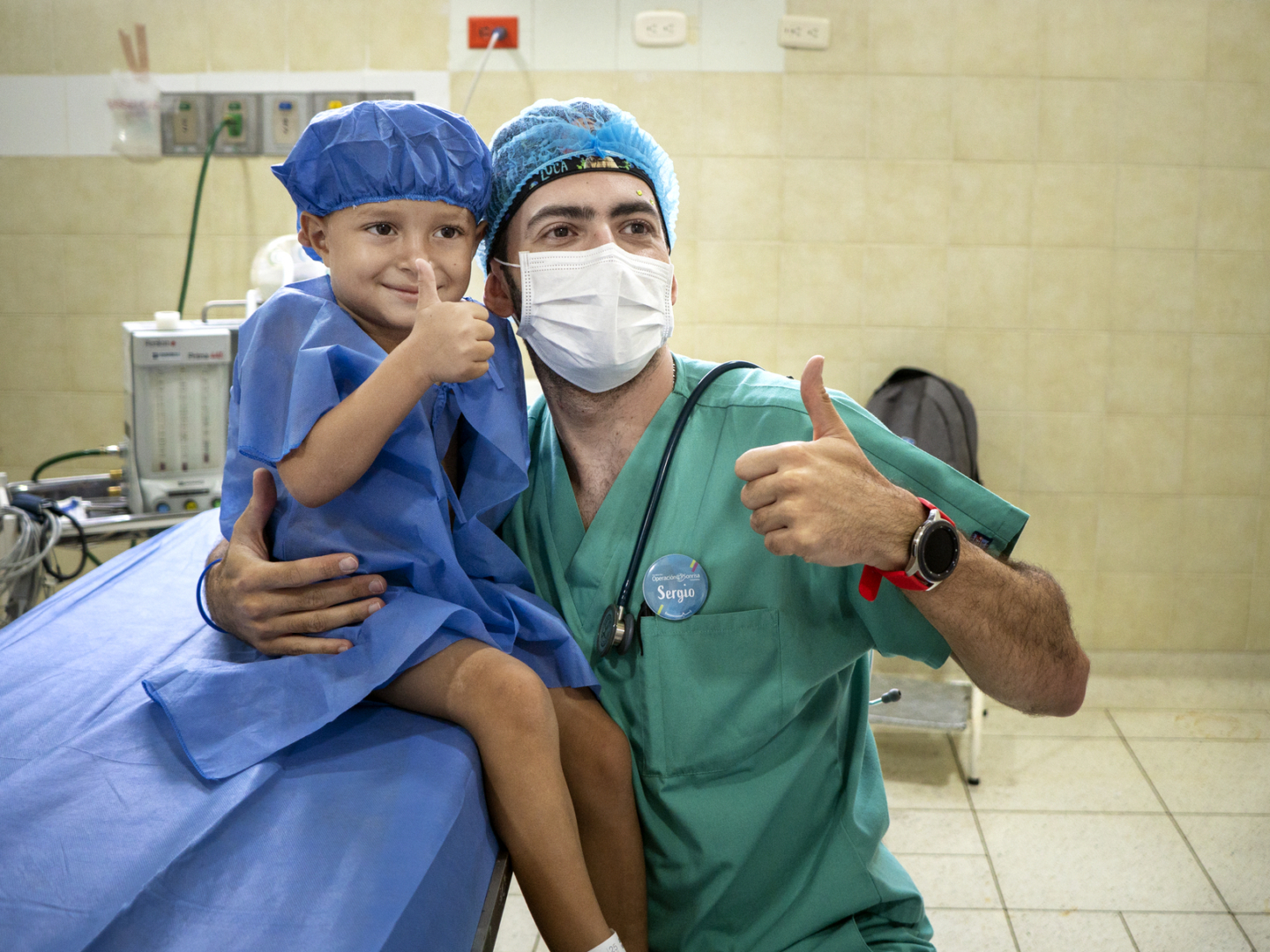 An anesthesiologist poses with his patient during a surgical program in Colombia.