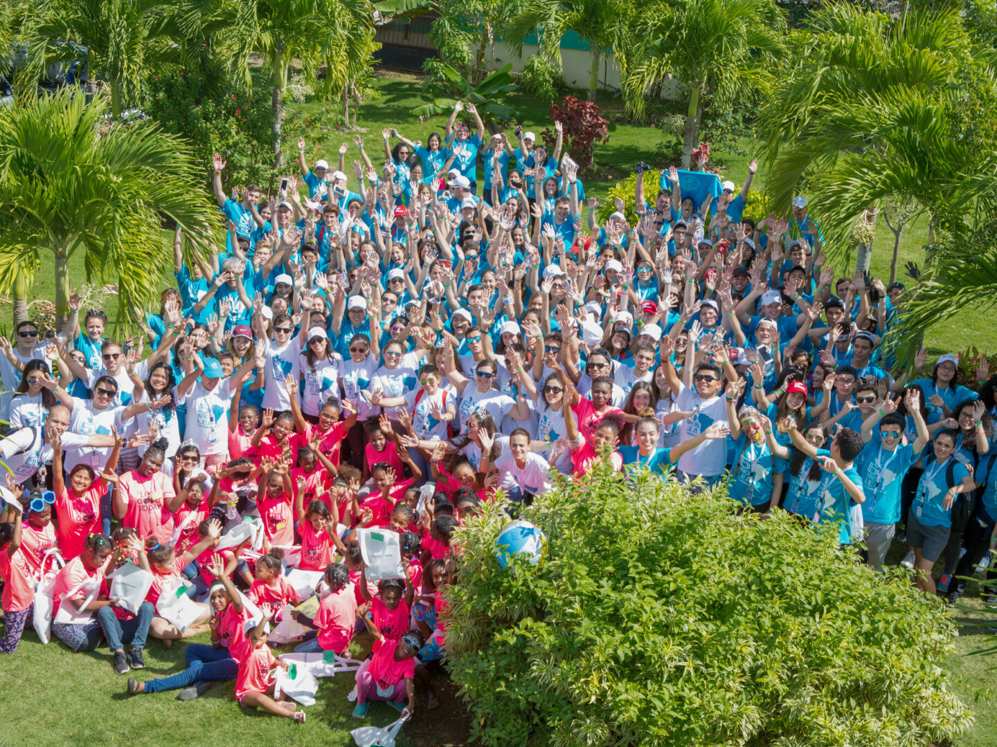 Students wave to the camera during the 2018 Latinoamérica en Acción in Santo Domingo, Dominican Republic.