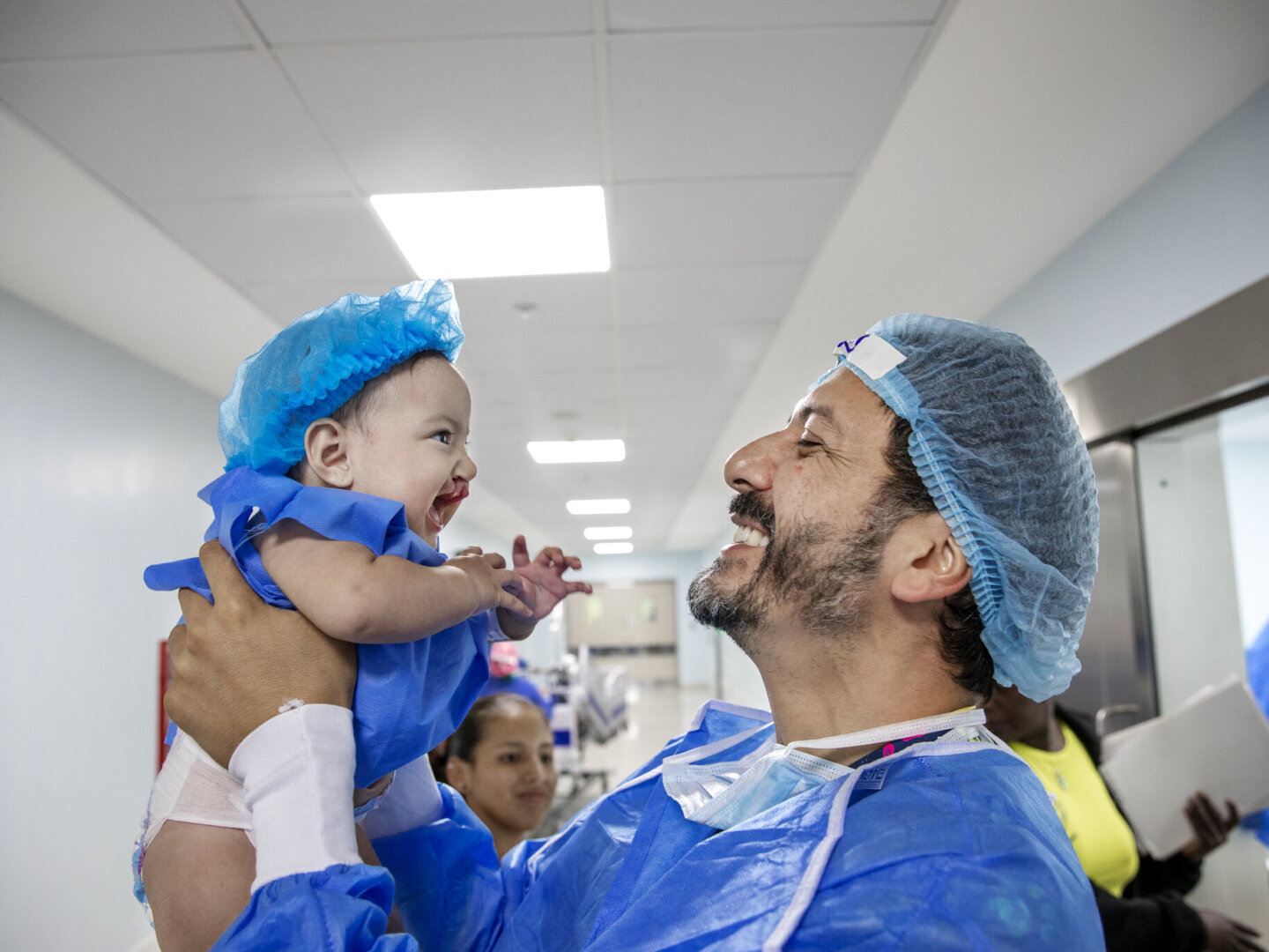 Amaia, before surgery, with an Operation Smile volunteer.