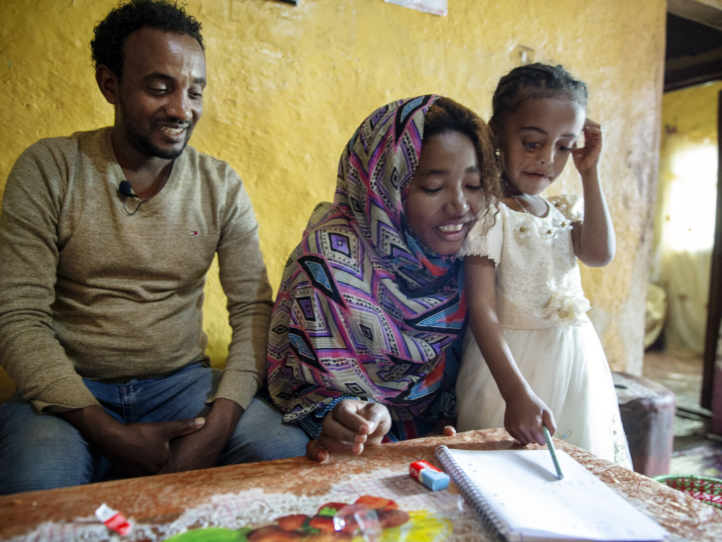 Meheftehe, after surgery, with her parents.