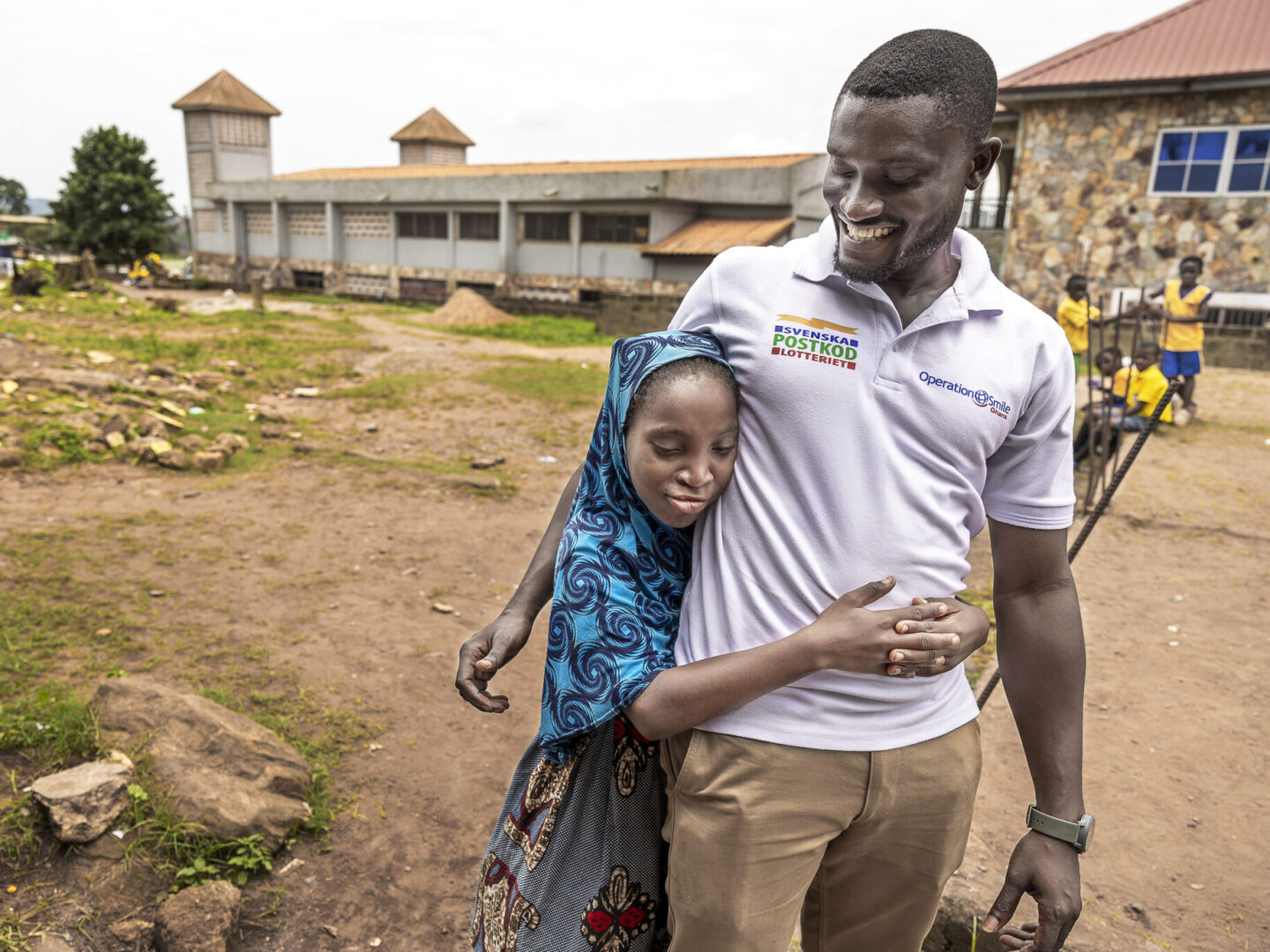Ramata hugs Kwaku Bekoe Obuobisha, speech program coordinator.
