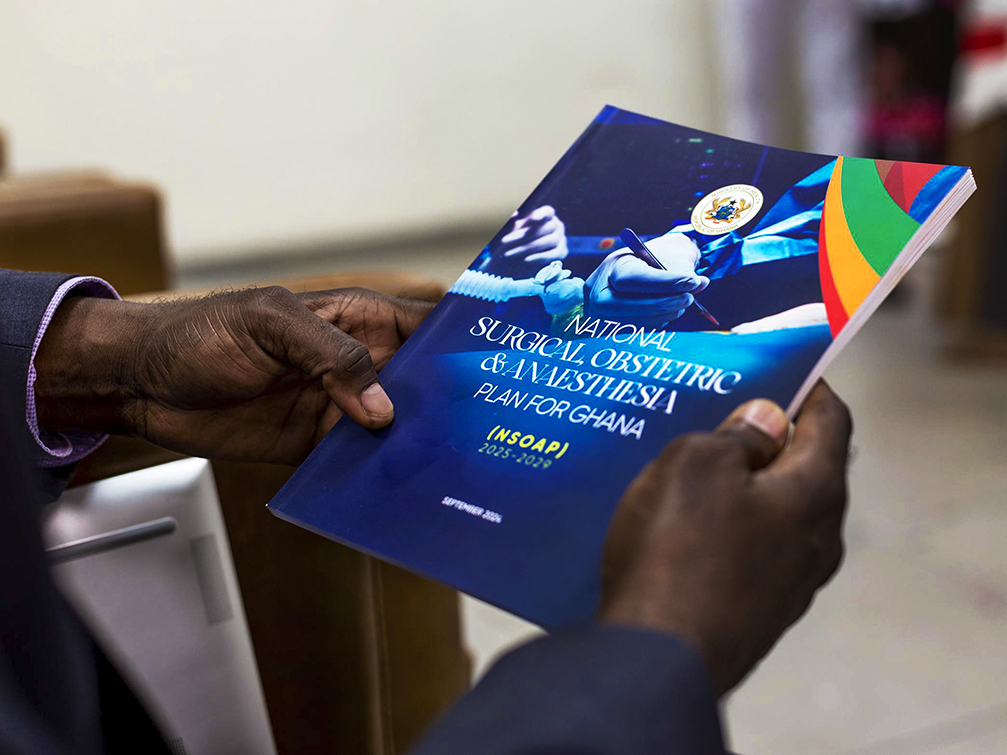 A copy of Ghana's National Surgical, Obstetric, and Anaesthesia Plan (NSOAP), held during event announcing the NSOAP