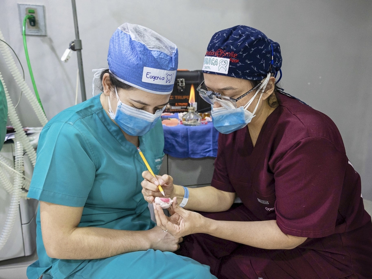 Volunteer dentist Dr. Monica De Leon of Guatemala, right, mentors fellow dentist Dr. Eugenia Azmitia of Guatemala about the specifics of creating obturators, which help patients born with cleft palate to feed. This took place during Operation Smile's health care training programs.
