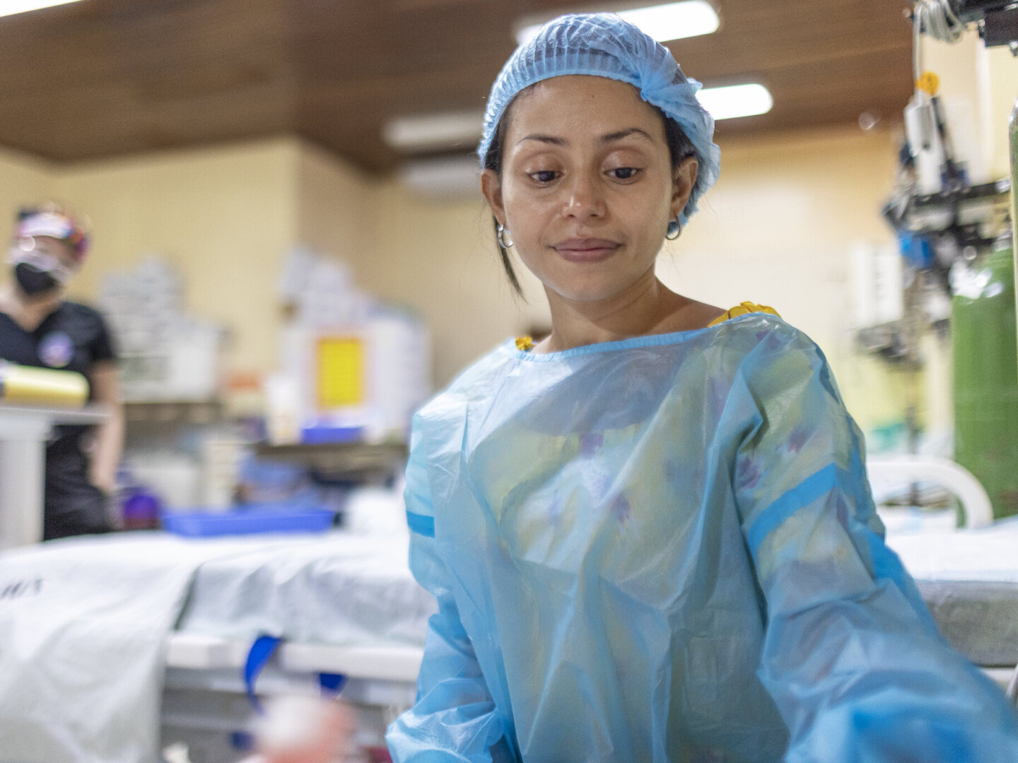 Ana looks on at her daughter, Zoe, after surgery.