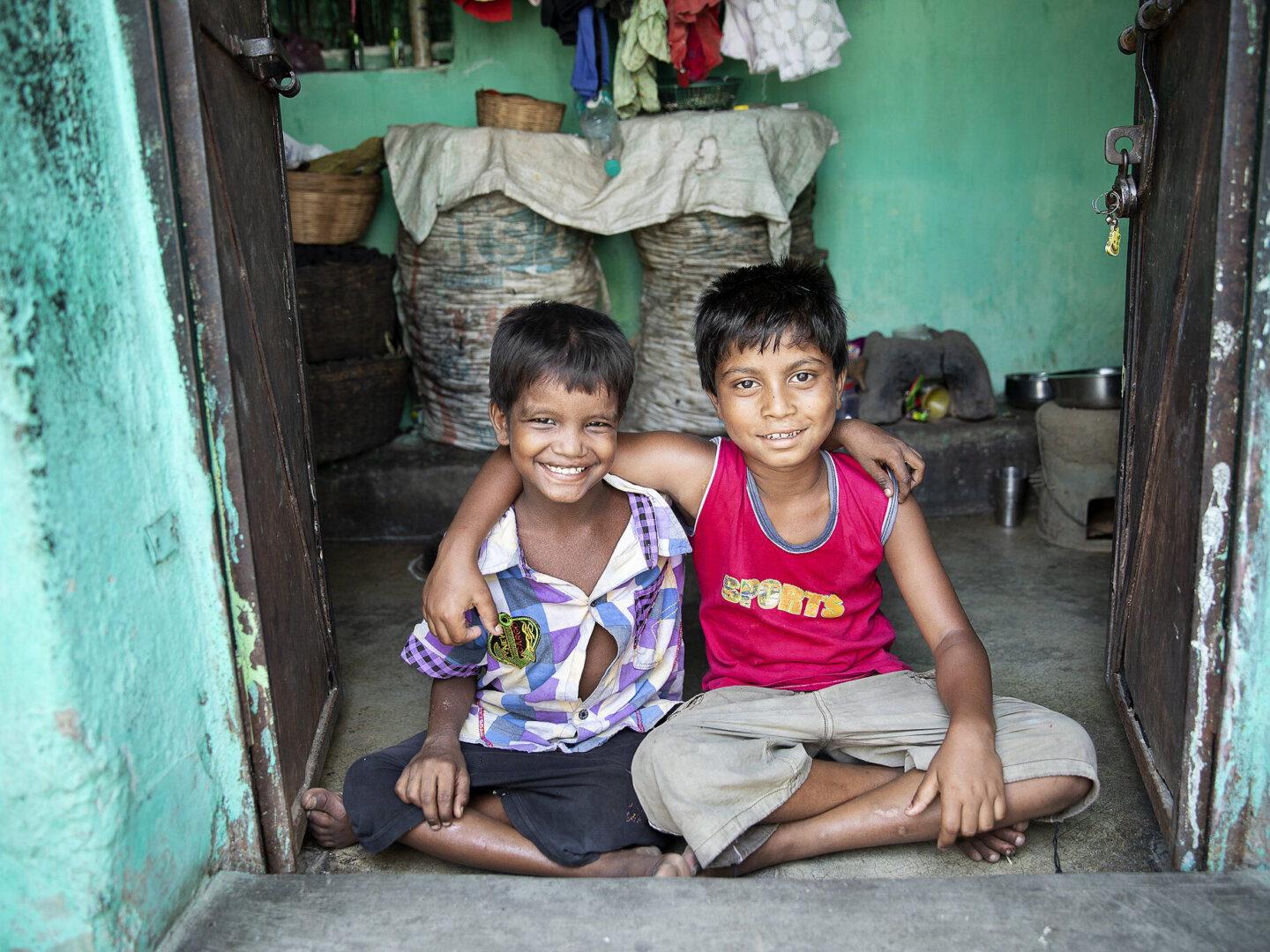 Monu and Bipul smile for the camera, one year after receiving surgery from Operation Smile.