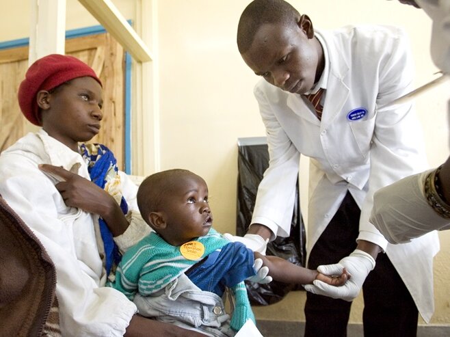 Abdulrazzaq Yongo examines a patient in Kenya.