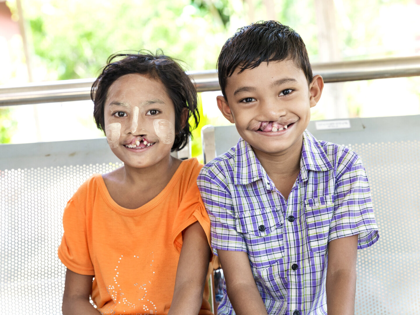Maung and Ma smile for the camera before surgery during a surgical program in 2017 in Myanmar.