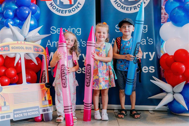 children holding crayons for back to school photo