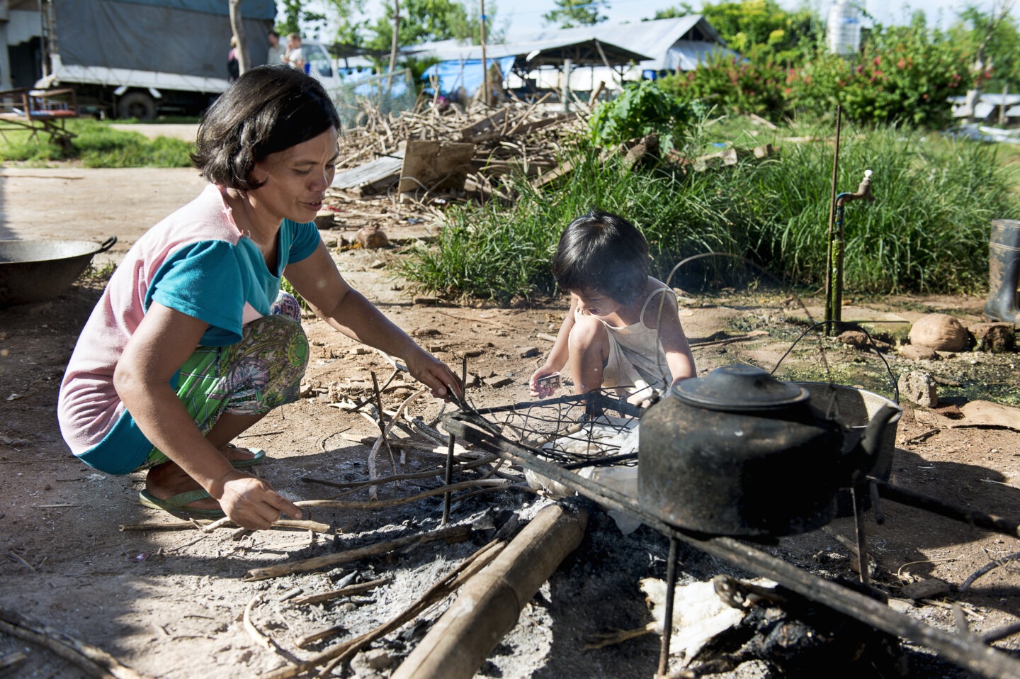 Loraine helps to cook in the Philippines.