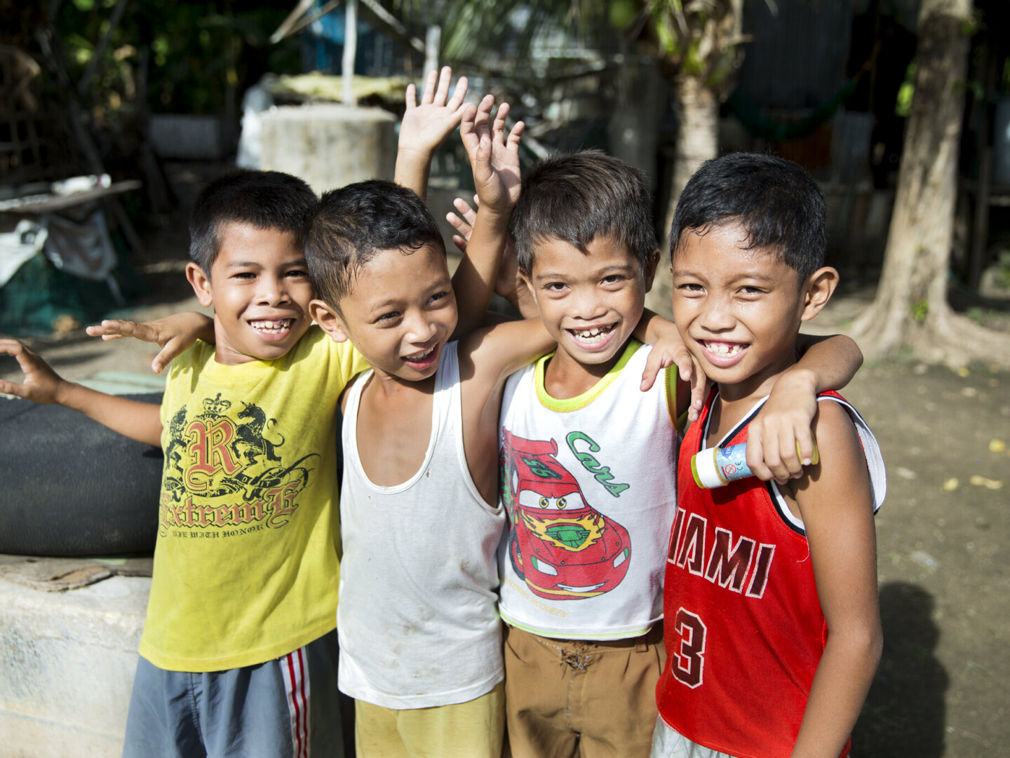 After his surgery, Efren smiles for the camera with friends.