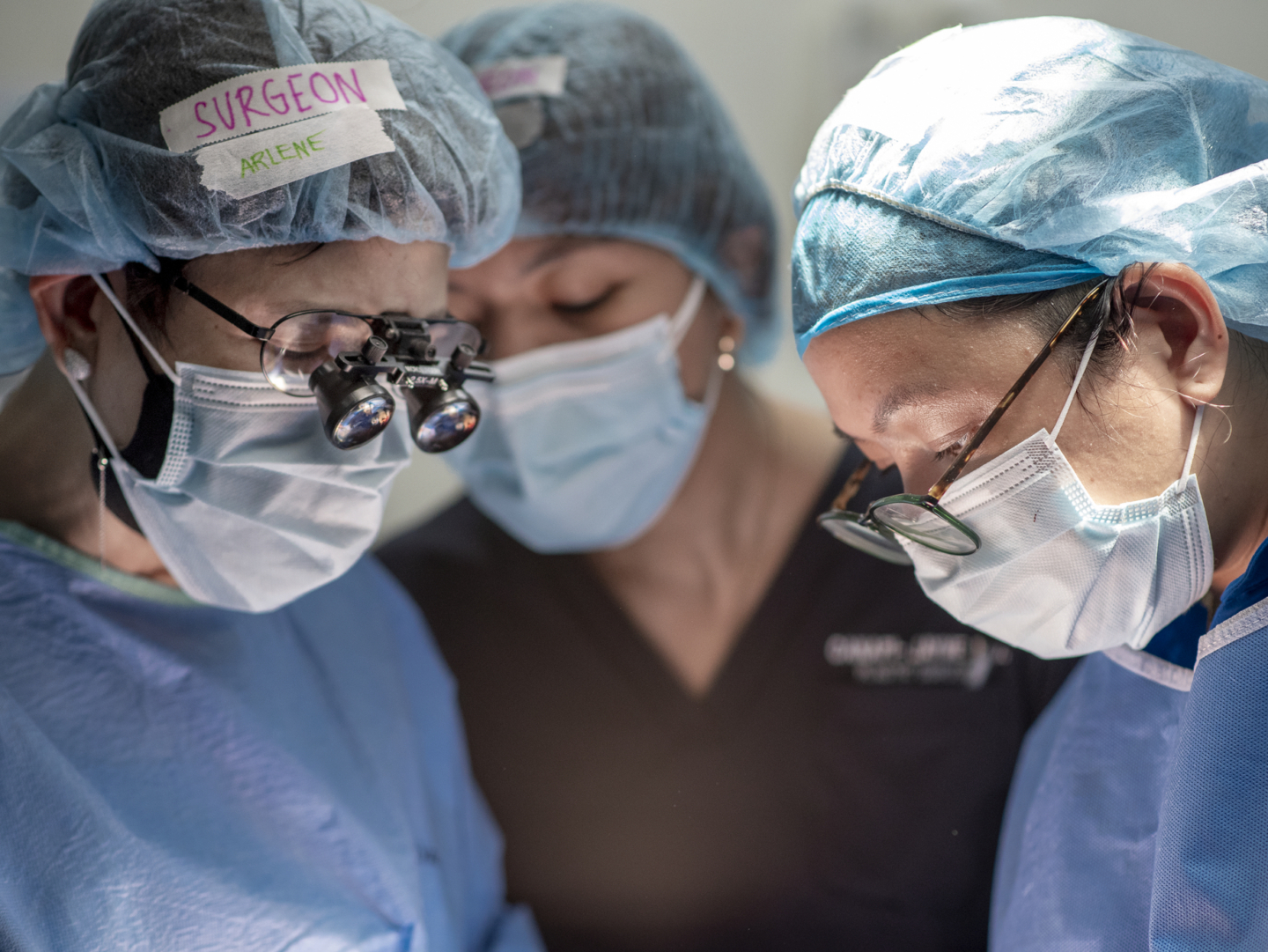 Volunteers treat a patient during the Women in Medicine surgical program in 2022. Women in Medicine is one program in which Operation Smile provides training to health care providers.