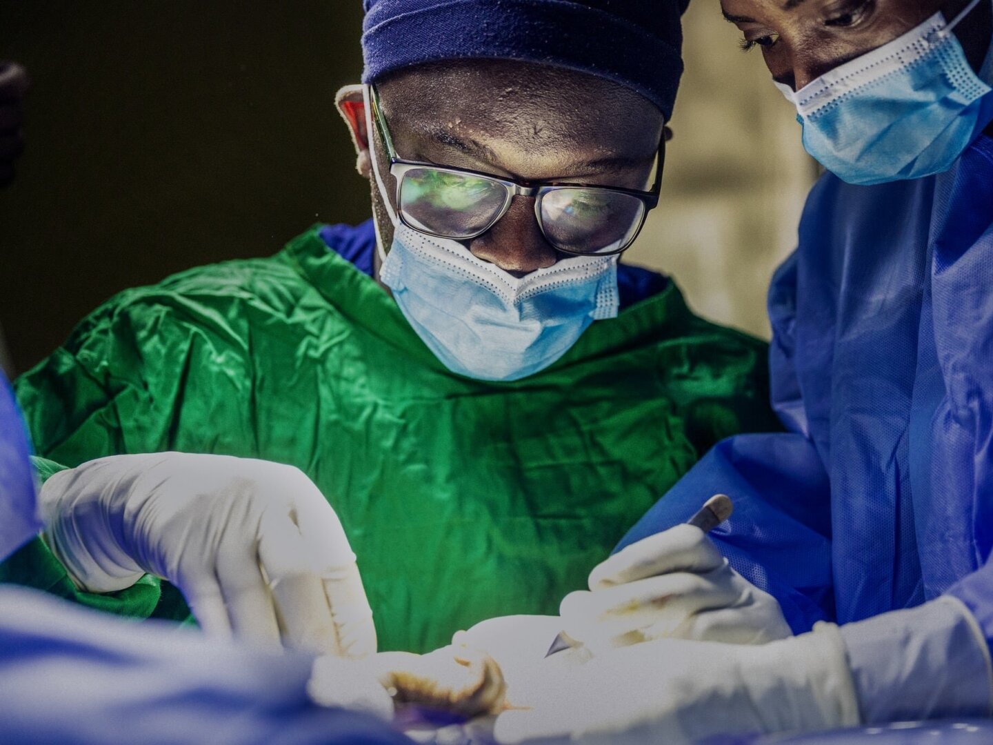 Surgeon Sibma Fidel provides care during a program in Kibuye, Rwanda.