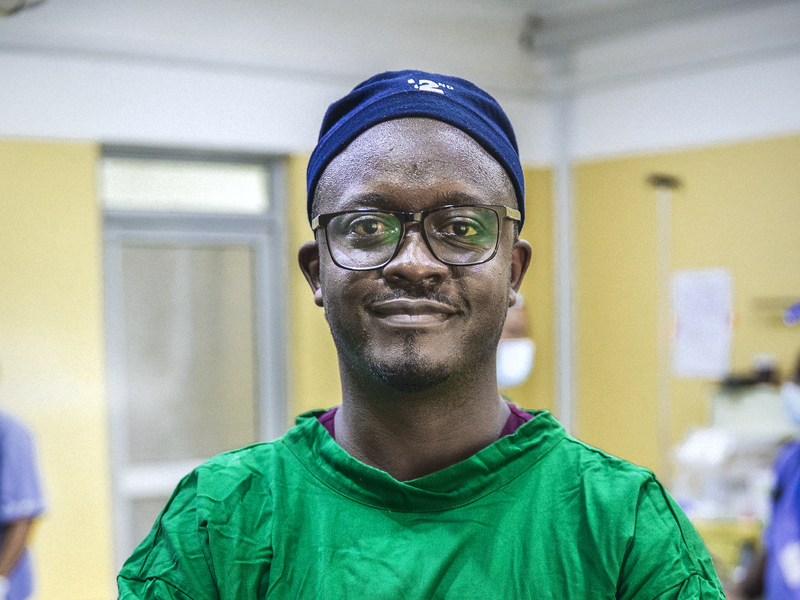 Dr. Simba looks at camera.