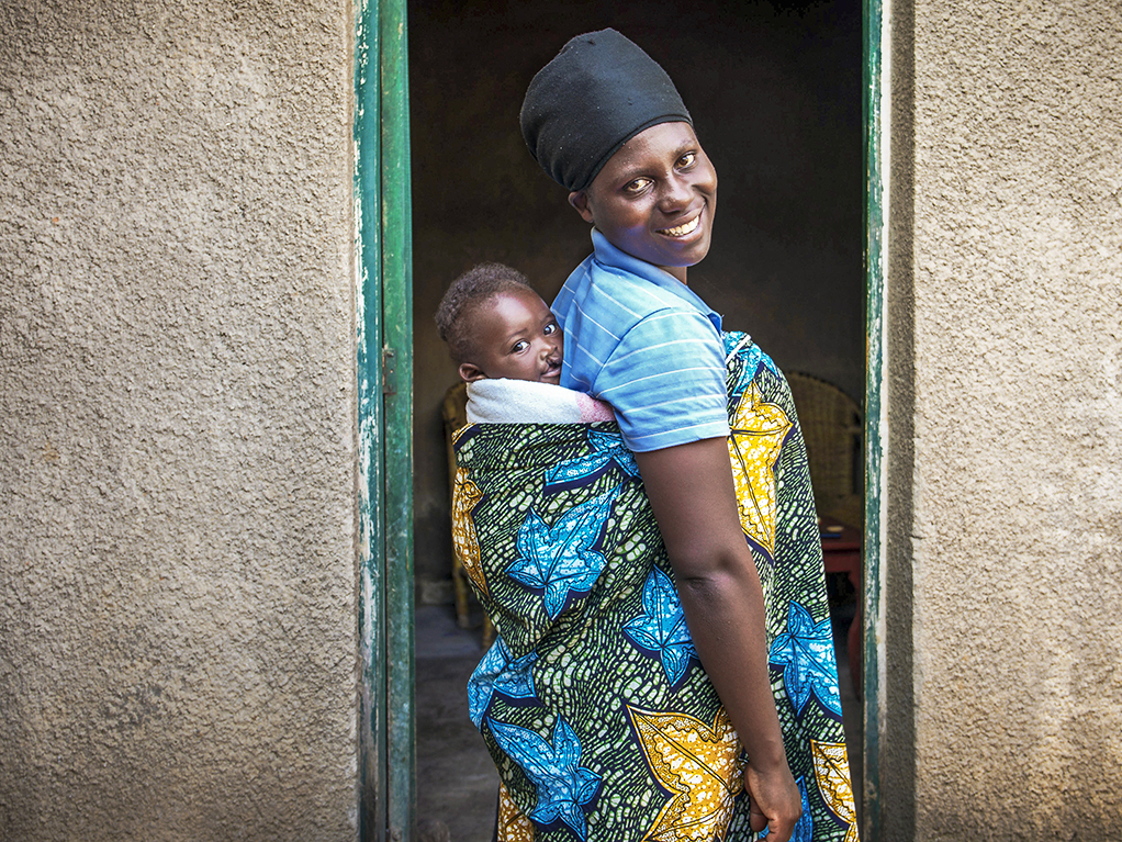 Adolphe and his mom smile for the camera.