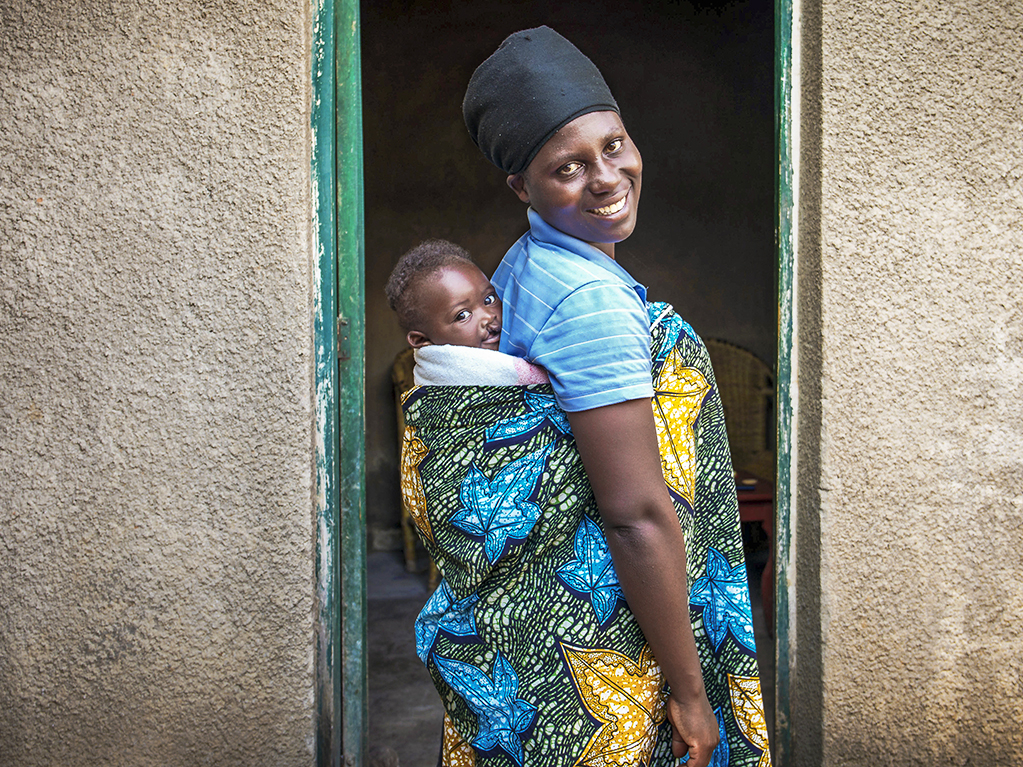 Adolphe and his mom smile for the camera.