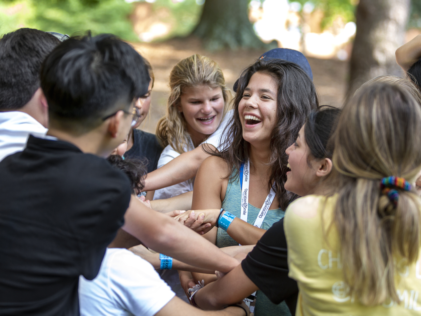 Students smile during an ice breaker at the 2019 International Student Leadership Conference.