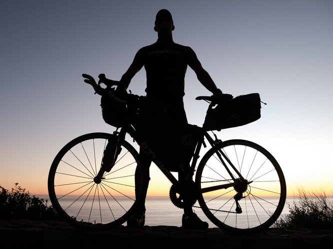 Dan Meyer stands with his bike.