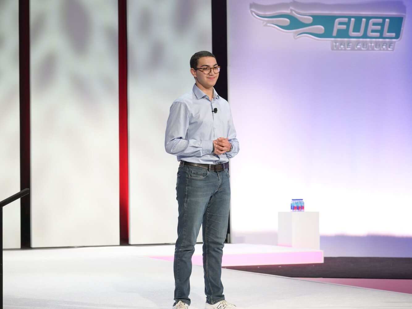 Patient advocate Aymane shares his story with more than 1,000 people during a corporate meeting.