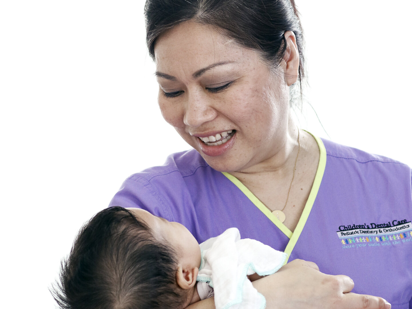 Dr. Dane Hoang comforts a young patient during the 2016 Operation Smile dental program at Hue Odonto-Stomatology Hospital in Hue, Vietnam.