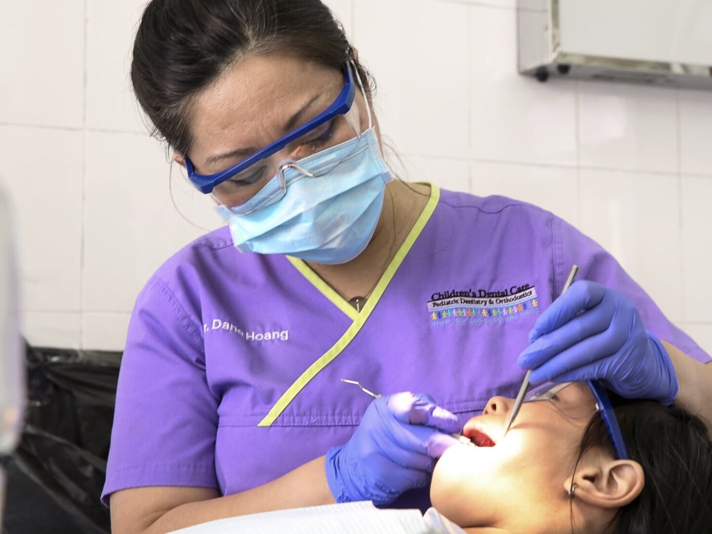 Dr. Dane Hoang provides a patient with dentistry during the 2016 Operation Smile dental program at Hue Odonto-Stomatology Hospital in Hue, Vietnam.