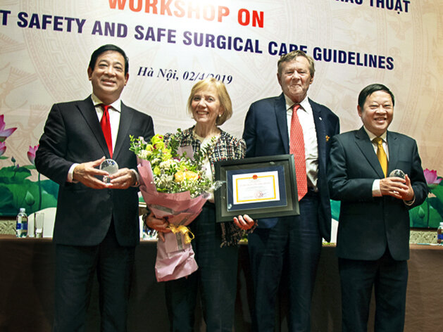 Associate Professor Dr. Luong Ngoc Khue, left, Director of Medical Services Administration Department of Vietnam's Ministry of Health; Kathy Magee, right, Operation Smile Co-Founder; Dr. Bill Magee, Operation Smile Co-Founder; and Professor Dr. Nguyen Viet Tien, Vice Minister of Vietnam's Ministry of Health, pose together for a photo.