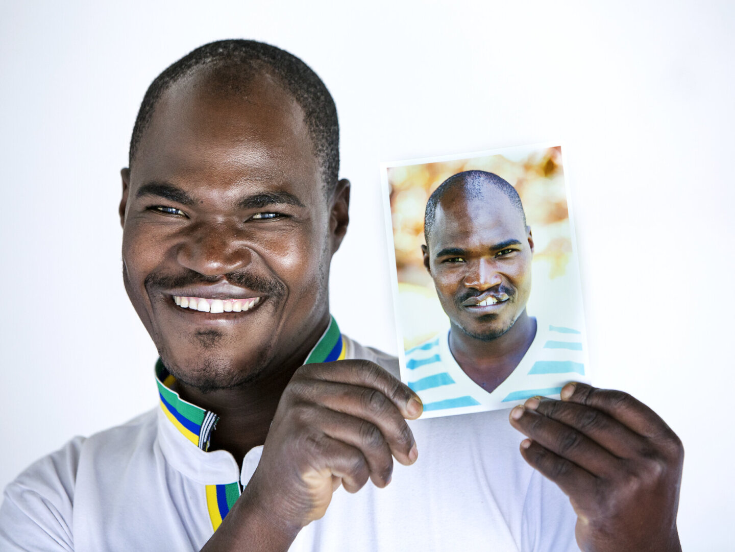 Ephraim poses with his before photo.