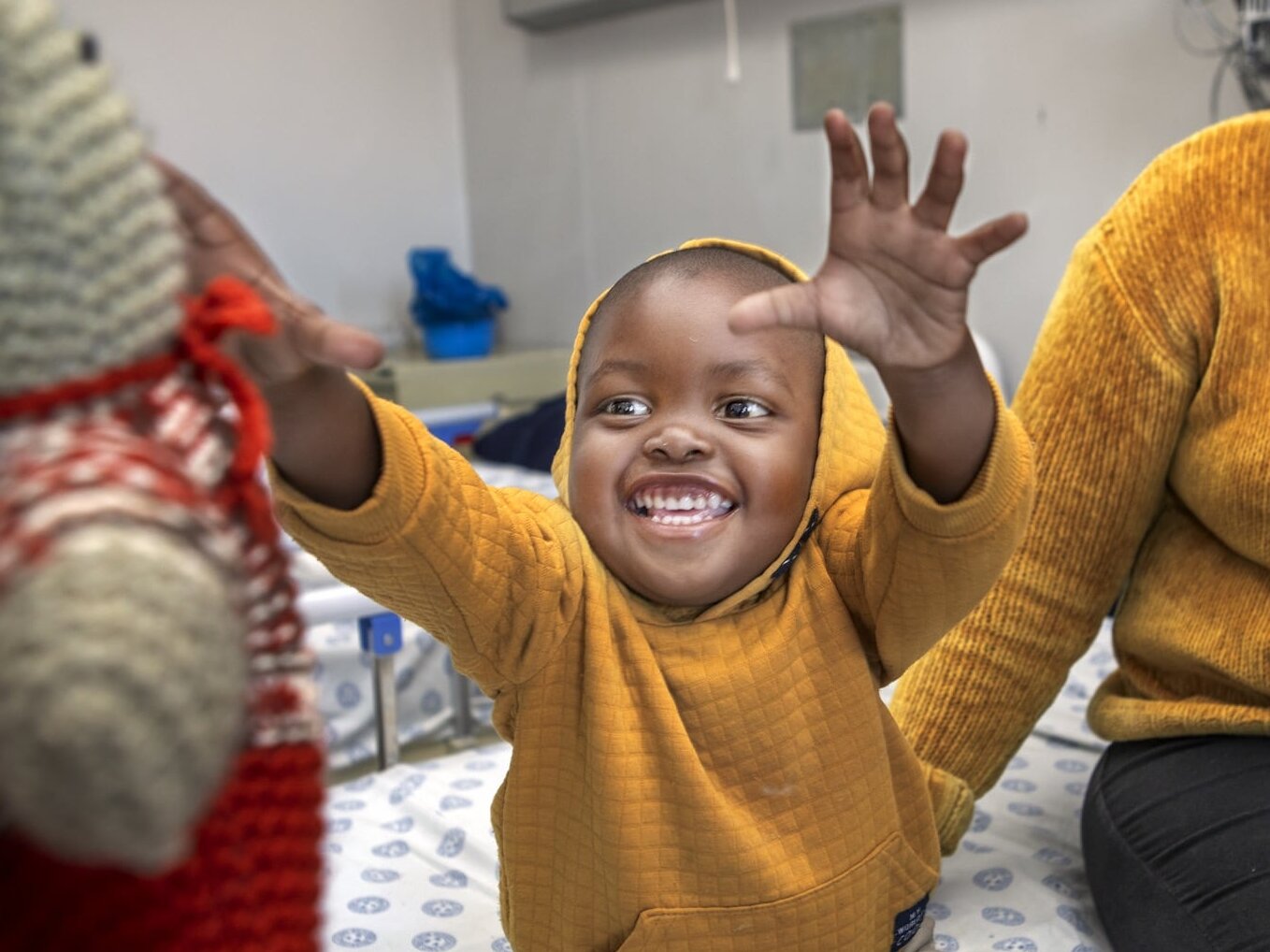 Seipati reaches for a toy during a surgical program in South Africa.