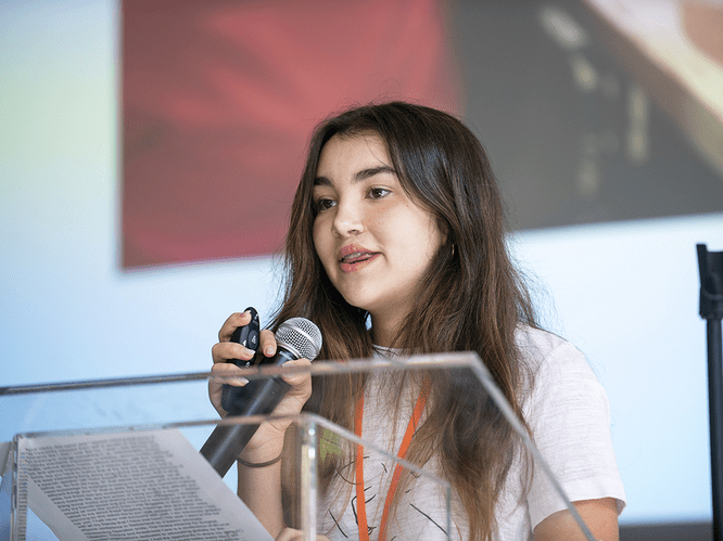 Patient advocate Laura Alvarez speaks at the International Student Leadership Conference.