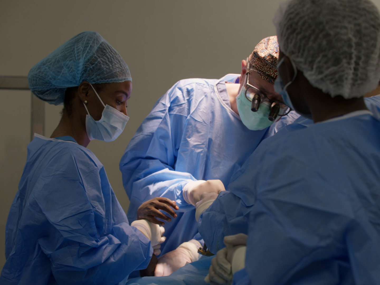 Health care providers care for patients in Rwanda.