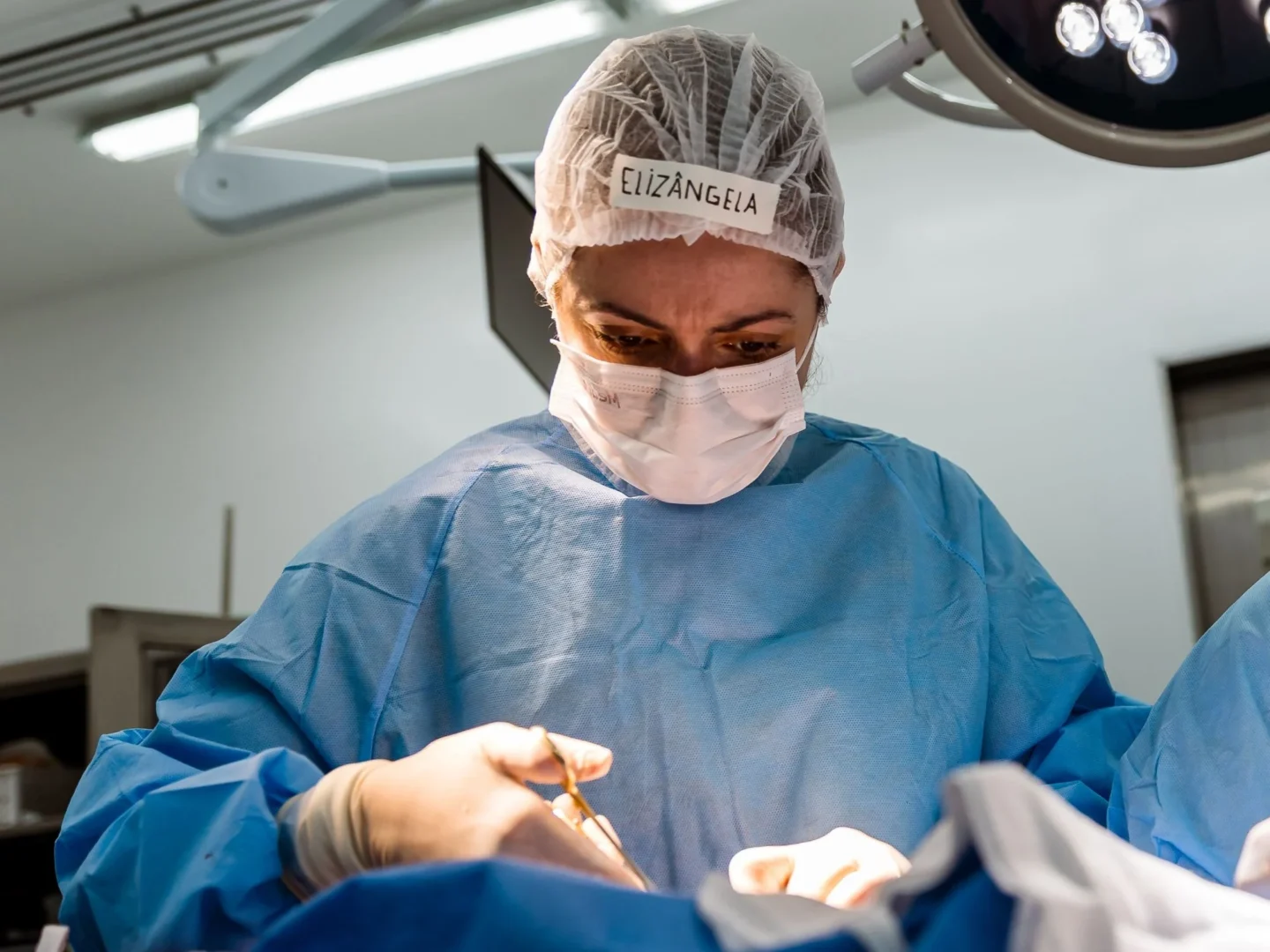 A doctor focuses during a surgical procedure in Brazil.