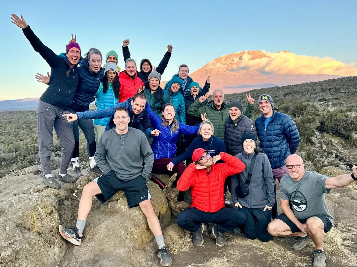 A group of hikers smile for the camera.