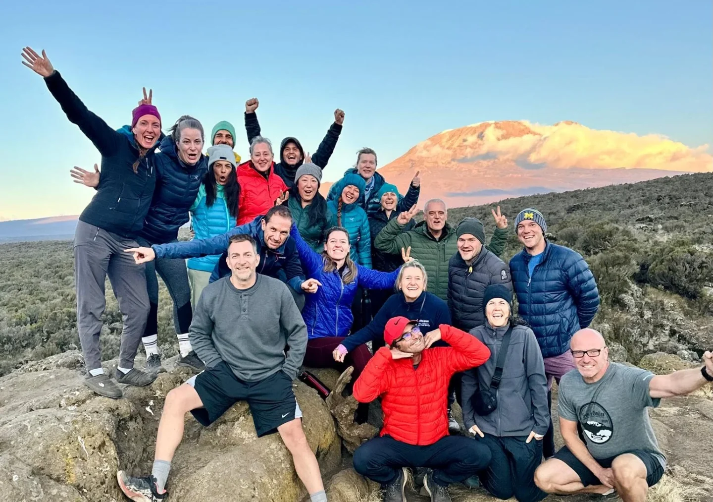 A group of hikers smile for the camera.