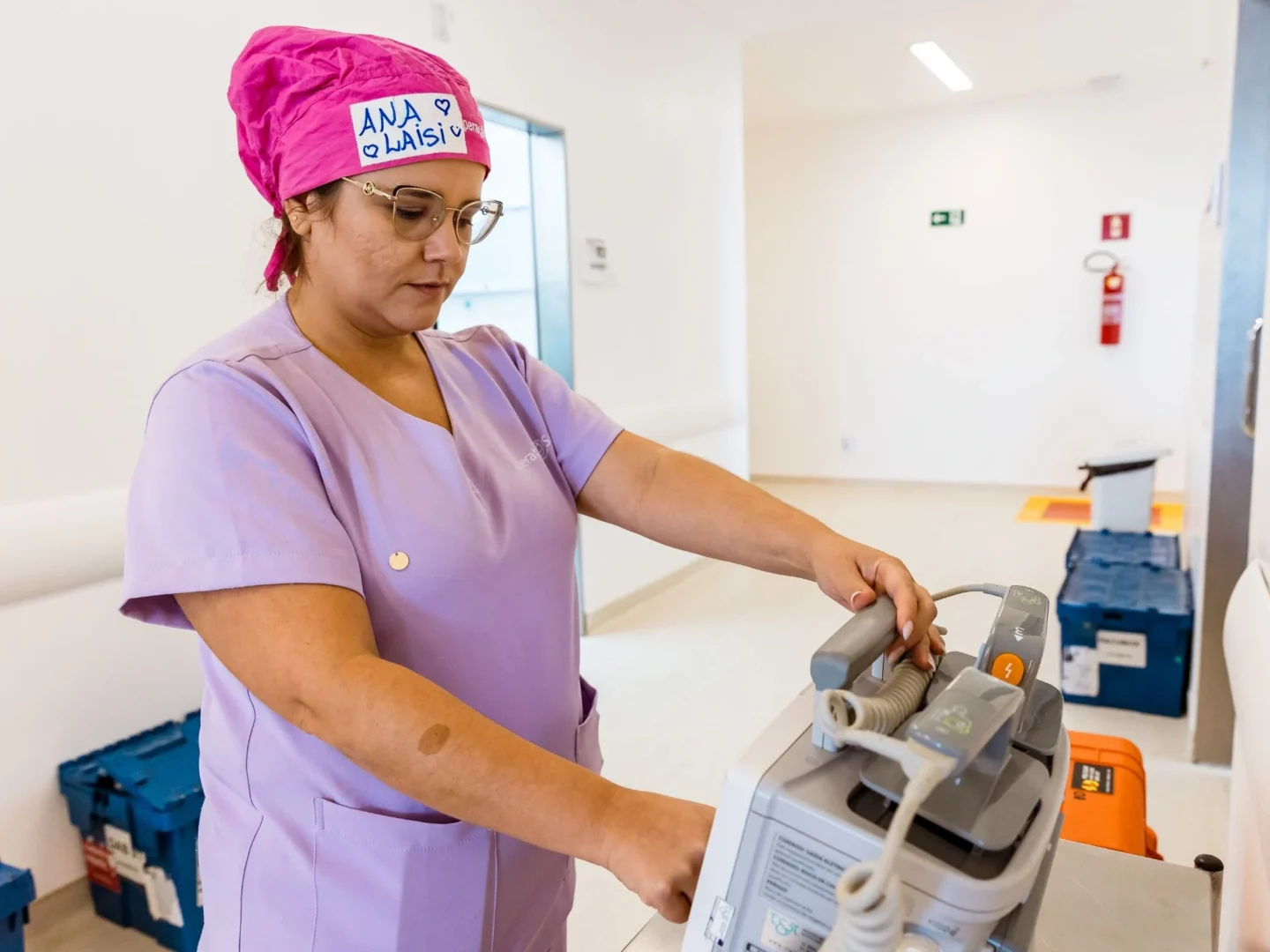 A biomed technician adjusts the equipment.