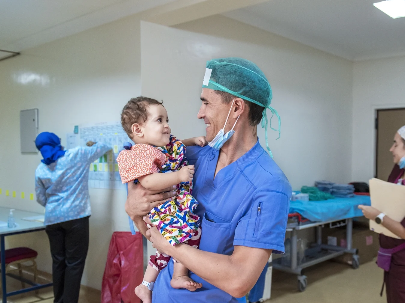 Dr. Paredes holds a patient at a program in Agadir.