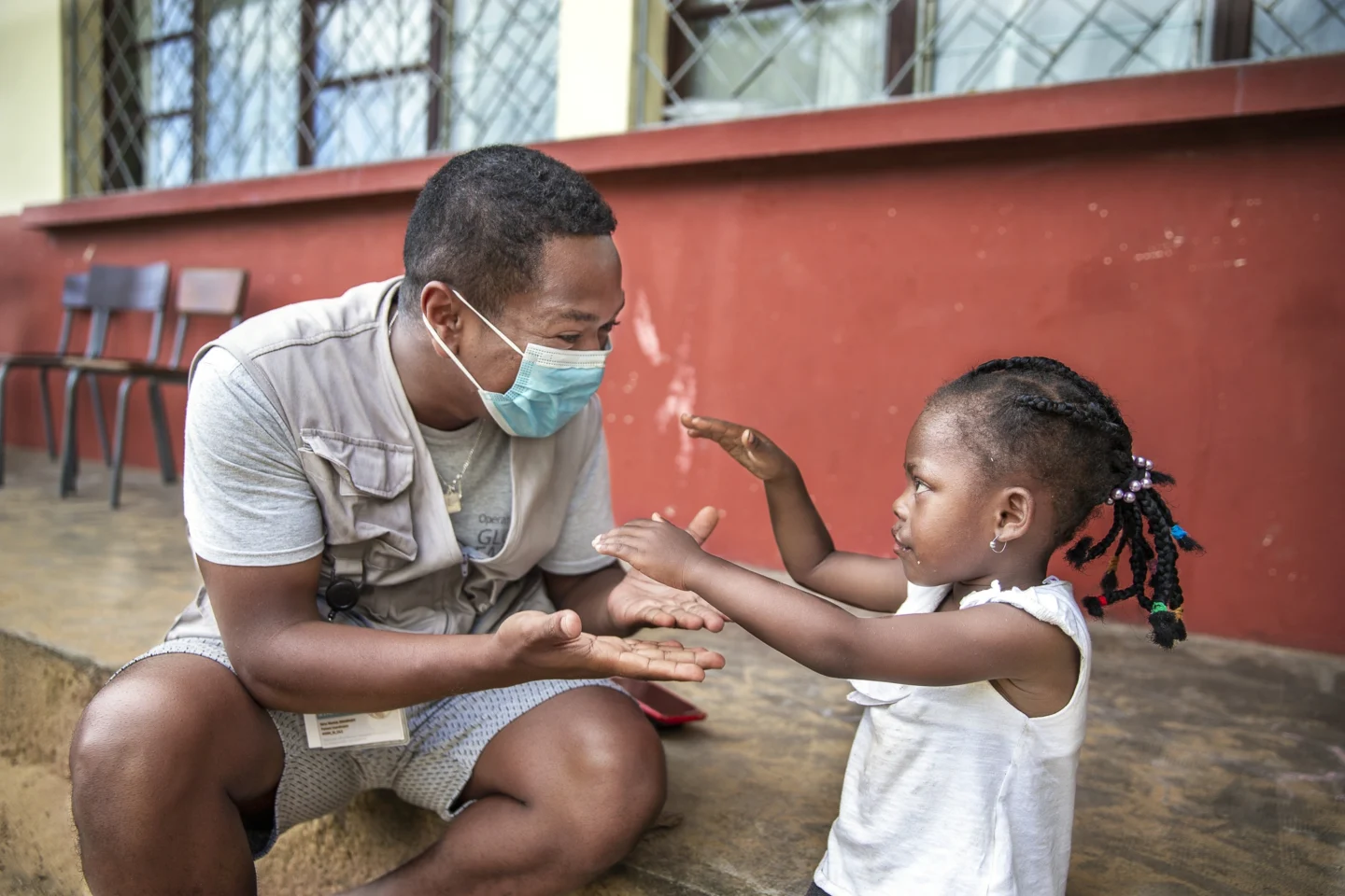 Patient Coordinator Eli Zakariasy plays with a patient during a program in Madagascar.