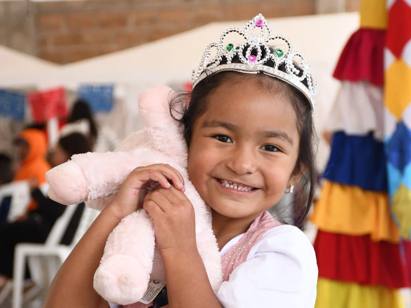 Li smiles for the camera while holding her stuffed bunny.