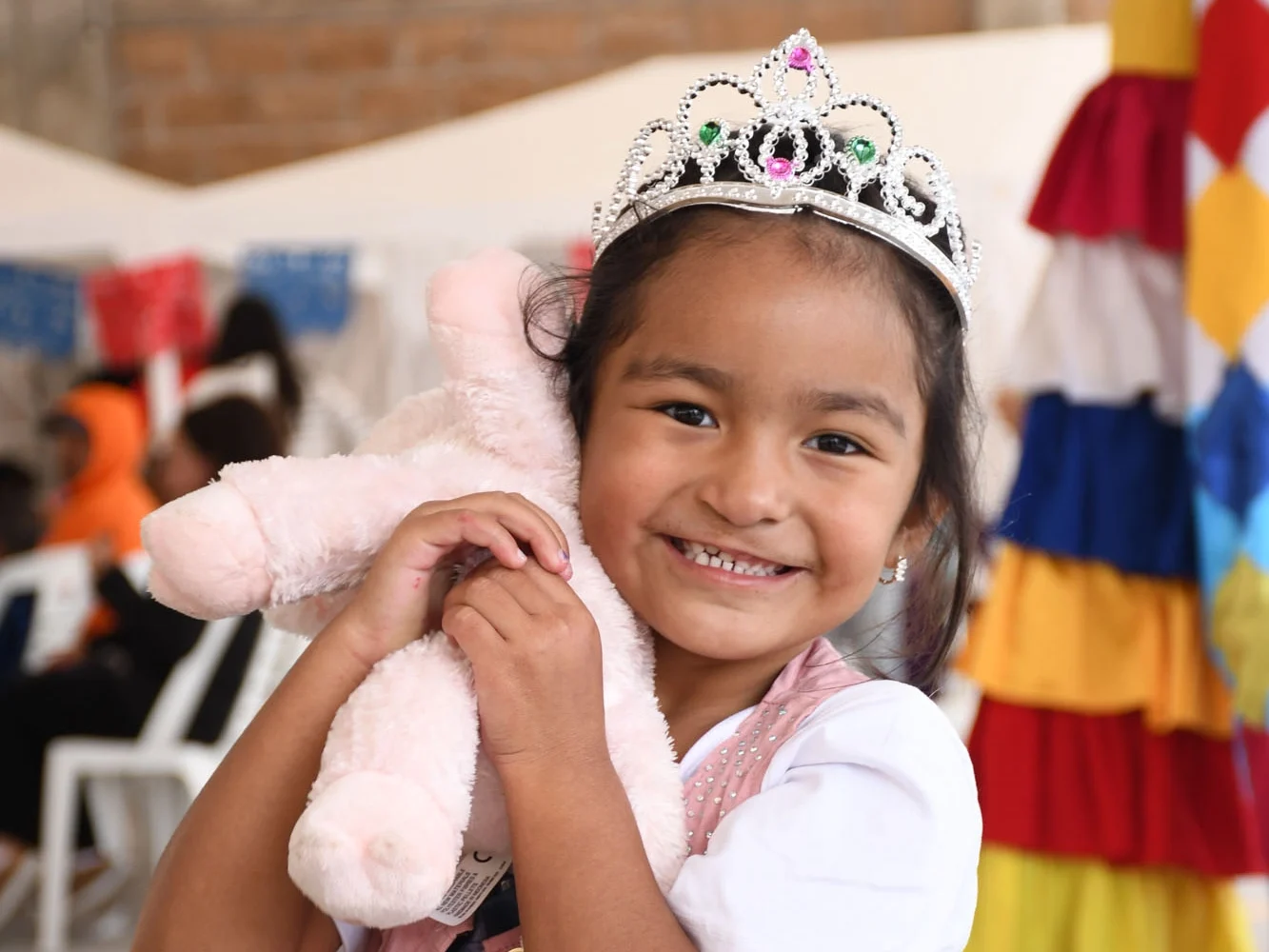 Li smiles for the camera while holding her stuffed bunny.