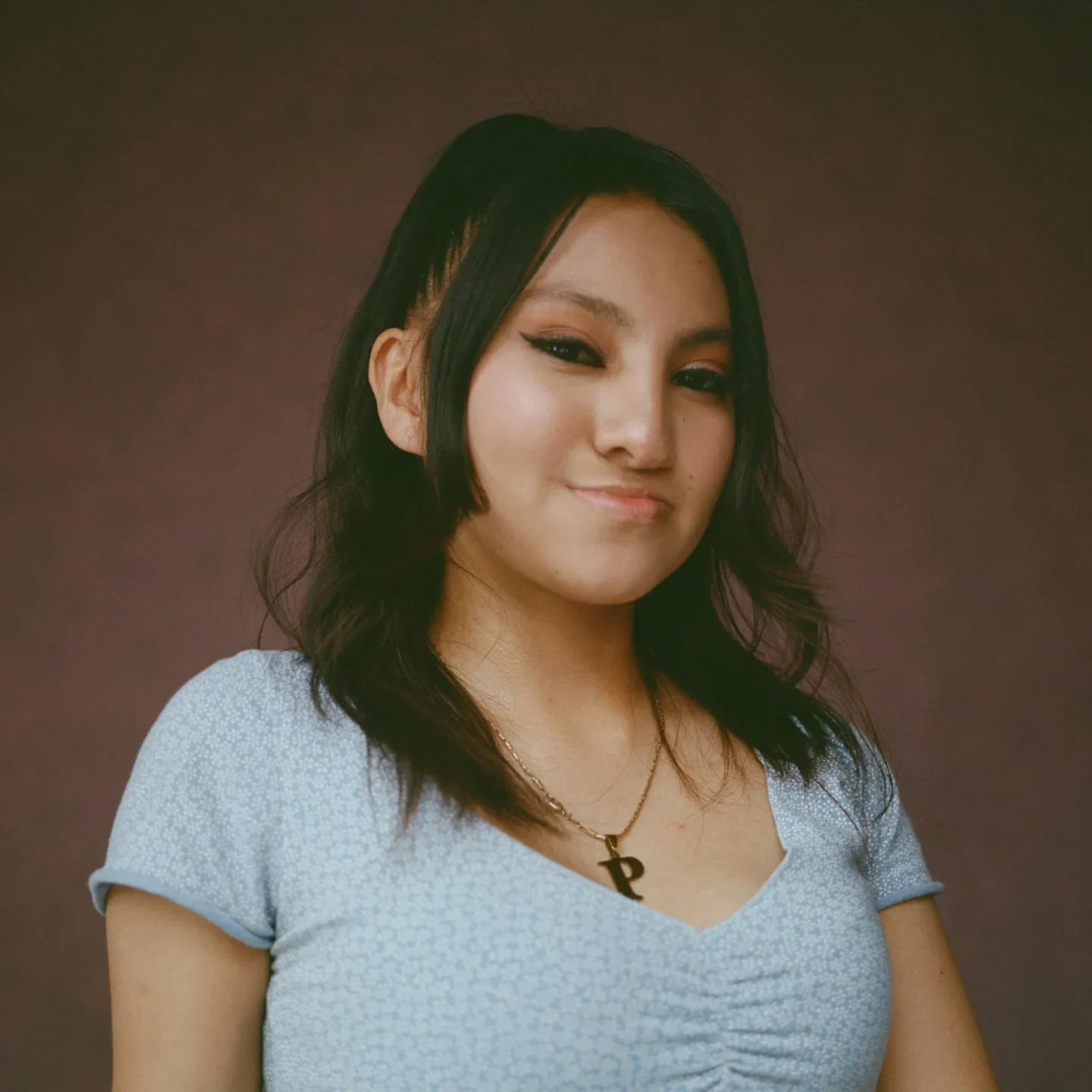 Palisha looks at the camera